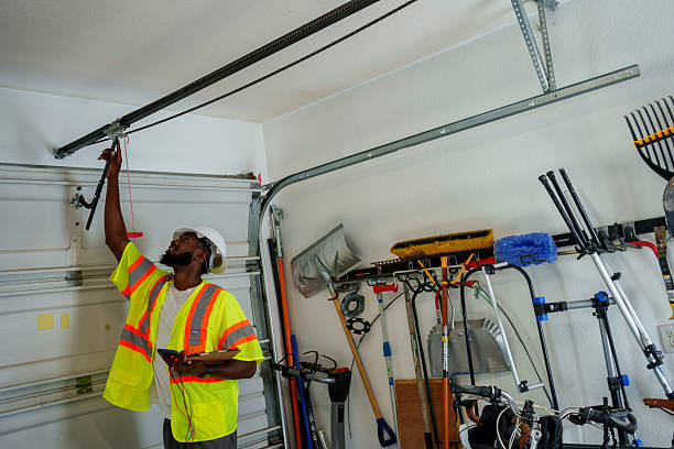 Professional Garage Door Panel Replacement technician working in Bluff City, TN